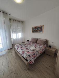 Posteľ alebo postele v izbe v ubytovaní Appartamento c&y Torelli 1