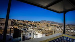 a view of a city from a building at Riad Green House in Fès