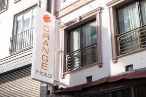 a hotel sign on the side of a building at ORANGE HOTEL & Spa in Istanbul