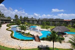 an aerial view of a resort with two pools at Flat 2302 - Flat no Beach Class Muro Alto 2 quartos - Praia de Muro Alto in Porto De Galinhas