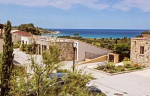 a house with a view of the ocean at Le Cocon Bord de mer in Belgodère
