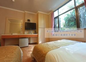 Foto sihtkohas Hualing asuva majutusasutuse 松林山莊 Songlin Holiday Inn galeriist