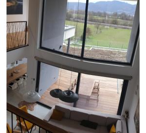 a view from the top of a house with a large window at HIRUNDO- villa with saunas and hot tub 