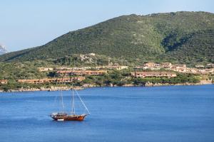 a boat in the middle of a large body of water at Casa Valery Wonderful Sea View in Porto Rotondo