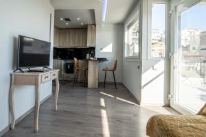 TV a/nebo společenská místnost v ubytování Dolce Vita-Roof Top