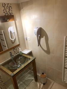 a bathroom with a sink and a mirror at Appartement tout confort - Belle vue sur le Cambre d'Aze in Bolquere Pyrenees 2000