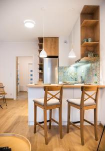 Kuchyňa alebo kuchynka v ubytovaní Mokotów Passion Apartment