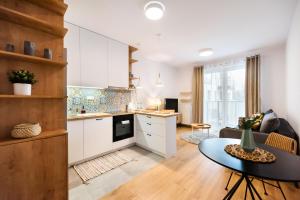 Kuchyňa alebo kuchynka v ubytovaní Mokotów Passion Apartment
