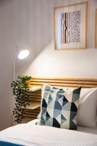 Posteľ alebo postele v izbe v ubytovaní Mokotów Passion Apartment