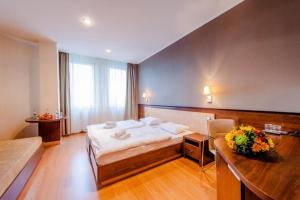 Postel nebo postele na pokoji v ubytování Congress Hotel Centrum