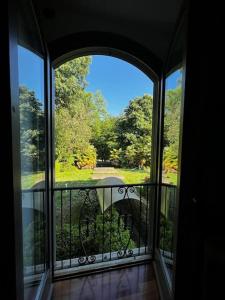 a view of a balcony with an open window at Appartamento in Villa Storica in Oleggio Castello