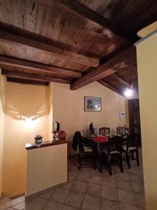 a dining room with a table and chairs at La Casa del Nonno in Porano +9 photos