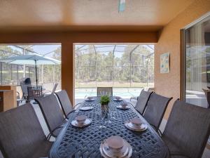 a dining room with a table and chairs at Casa Amore at Ellis Exclusive Villas in Davenport