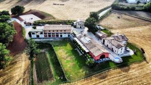 an aerial view of an old building in a field at Agriturismo Casale Montebello in Monteleone di Spoleto