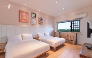 Postel nebo postele na pokoji v ubytování 好室一庒House in field宜蘭獨棟平房民宿 可包棟