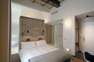 A bed or beds in a room at Vibe Nazionale Még 37 kép