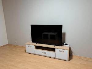 a flat screen tv sitting on top of a white entertainment center at Apartmán Chiarita in Nemšová