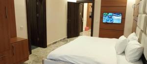 Postel nebo postele na pokoji v ubytování Fahrenheit Apartments
