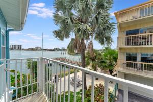 a balcony of a condo with a view of the water at The Seashell Suite with Private Balcony and Walk to Beach in Clearwater Beach