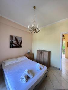 A bed or beds in a room at Ria Apartments