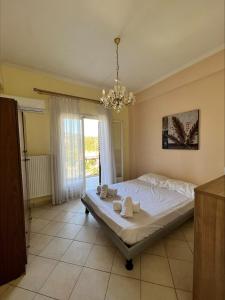 A bed or beds in a room at Ria Apartments