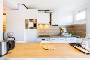 Kuchyňa alebo kuchynka v ubytovaní double appartement, saint michel, parking, wifi