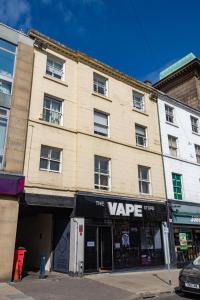 a building with a sign that reads the verge at Market Square Apartments in Huddersfield
