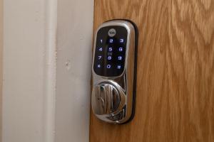 a close up of a remote control on a door at Market Square Apartments in Huddersfield