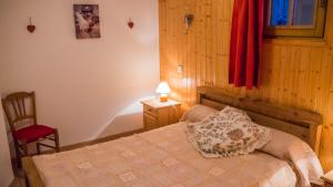 En eller flere senge i et værelse på appartement charmille