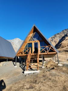 a house is being constructed in the mountains at Hill silence in Kazbegi