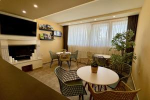 A television and/or entertainment centre at AquaSun Family Hotel