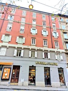 a large building with a store in front of it at CASA BOUNTY in Trieste