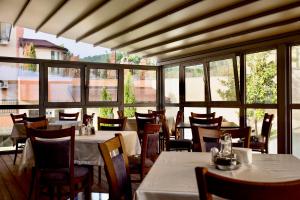 A restaurant or other place to eat at AquaSun Family Hotel