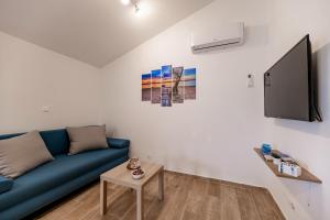 Telewizja i/lub zestaw kina domowego w obiekcie Holiday Home Aria