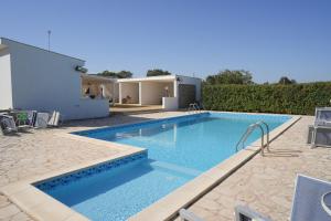 a swimming pool in the backyard of a house at Antiche Dimore TerraRossa in Alberobello