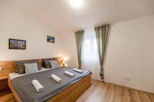 Łóżko lub łóżka w pokoju w obiekcie Holiday Home Aria