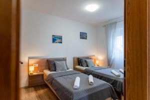 Łóżko lub łóżka w pokoju w obiekcie Holiday Home Aria