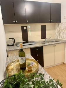 a bottle of wine on a table in a kitchen at Fun house in Zebanec-Selo +6 photos