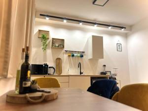 a kitchen with a table and chairs in a room at Deja Vu suite . Feel like Home in Majdal Shams