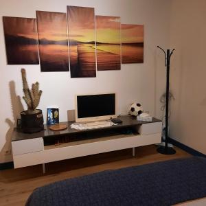 a room with a desk with a computer on it at REVES BLEUS in Crans