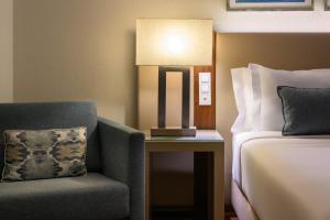 Postel nebo postele na pokoji v ubytování Melia Lisboa Oriente Hotel