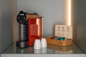 Příslušenství pro přípravu čaje a kávy v ubytování Melia Lisboa Oriente Hotel
