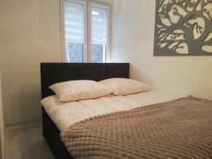 Posteľ alebo postele v izbe v ubytovaní Apartament Stella