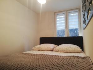 Posteľ alebo postele v izbe v ubytovaní Apartament Stella