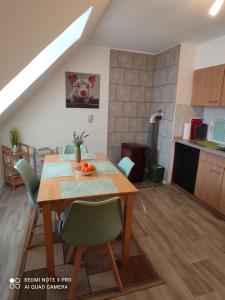 a kitchen and dining room with a table and chairs at Ferienwohnung Grote in Deensen