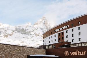 a hotel with a view of a mountain at Valtur Cristallo Ski Resort, Dependance Cristallino in Breuil-Cervinia