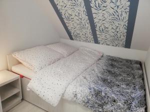 Posteľ alebo postele v izbe v ubytovaní Apartament Stella