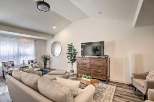 a living room with a couch and a tv at Quiet House with Yard 12 Mi to Dtwn Dallas! in Dallas
