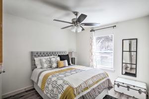 a bedroom with a bed and a ceiling fan at Quiet House with Yard 12 Mi to Dtwn Dallas! in Dallas