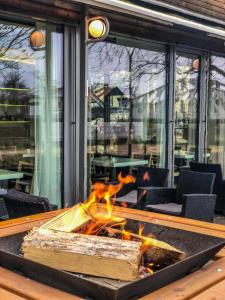 a fire pit in the middle of a patio at Apartmány Lanna in České Budějovice